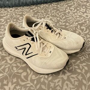 New Balance White Sneakers with Black Logo Accent